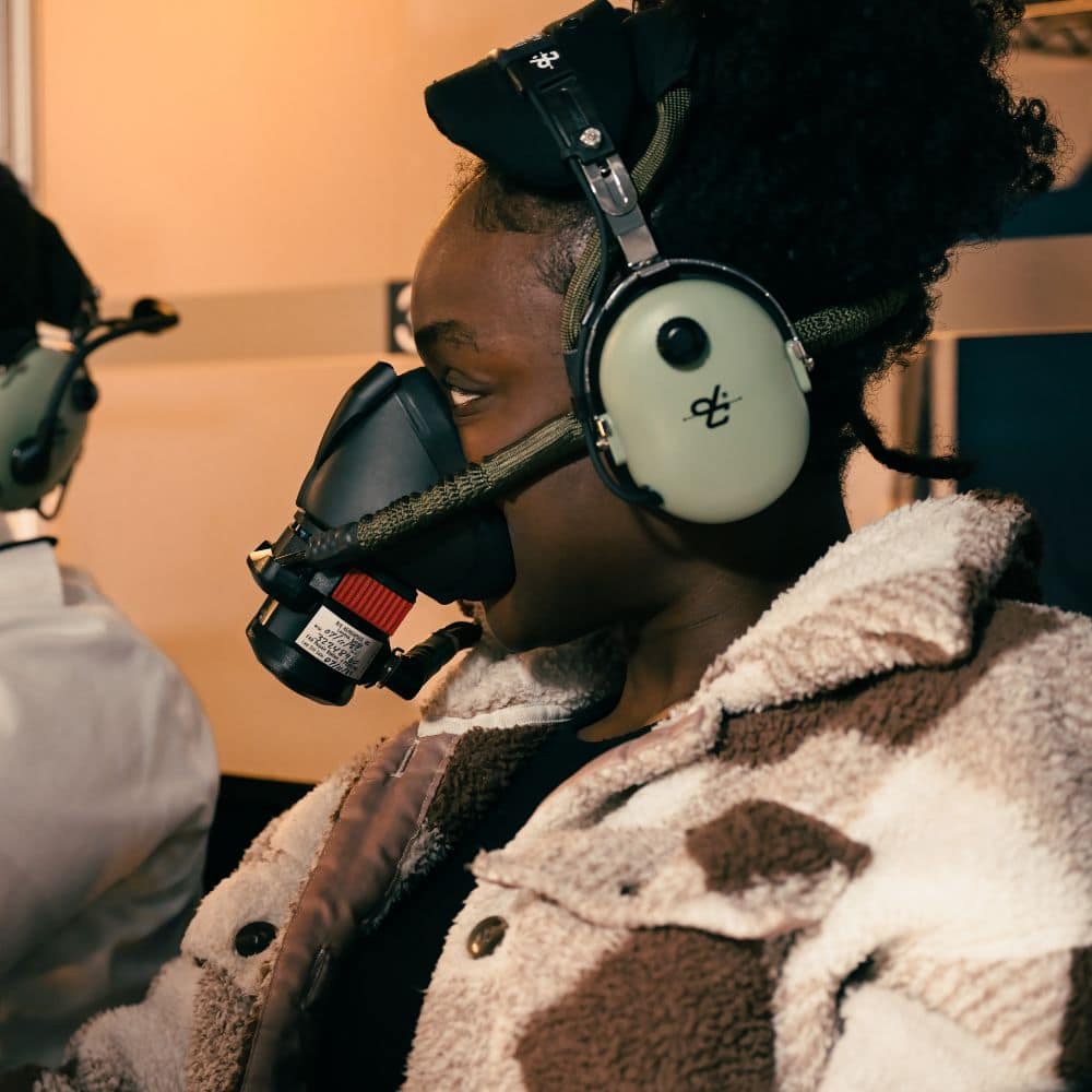 Two students listen to instructions as they get ready to experience the first-hand impact of hypoxia. (Photo: Embry-Riddle / Bill Fredette-Huffman)