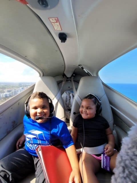 Jacobs' children enjoy a flight along with their father. (Photo: Nick Jacobs)
