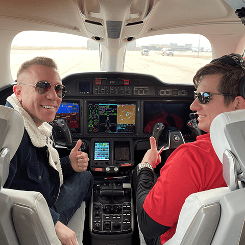 Matthew Henkel (left) on the flight deck of a Honda Jet with Embry-Riddle Prescott Campus alumnus Kevin Holbrook (’10), who is type-rated on the Boeing 757 and 767 and flies a Citation 10 for private jet company Wheels Up.