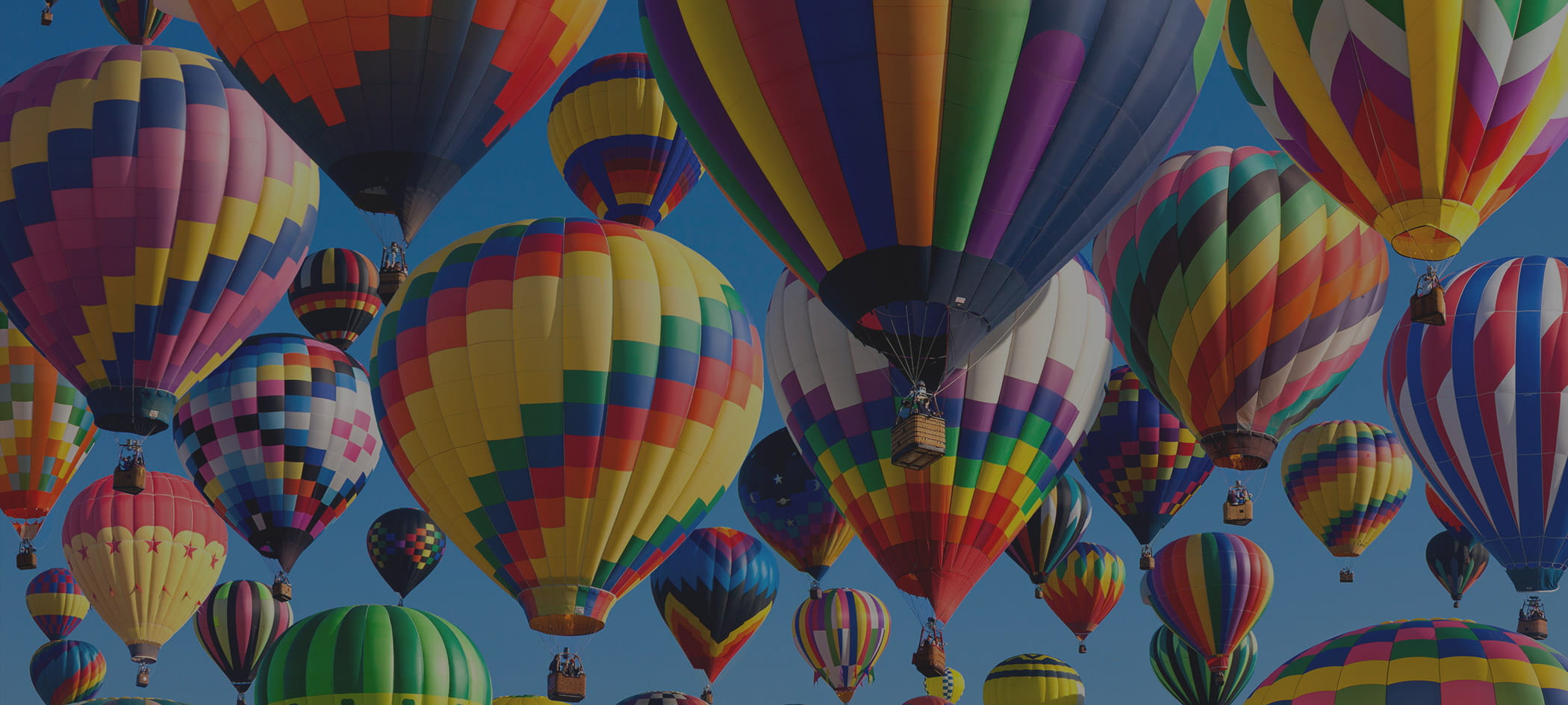 Hot air balloons against a blue sky