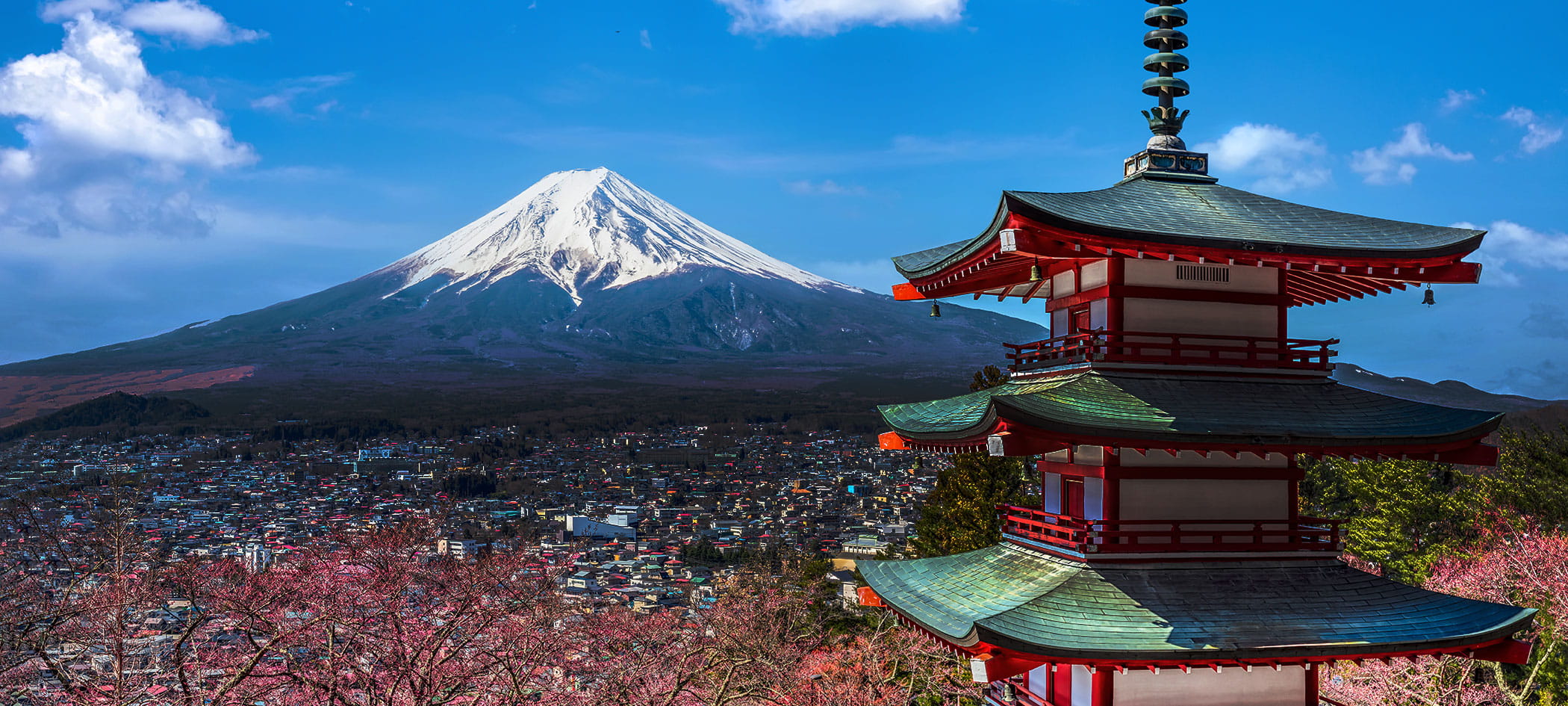 Mount Fuji in with a blue sky.