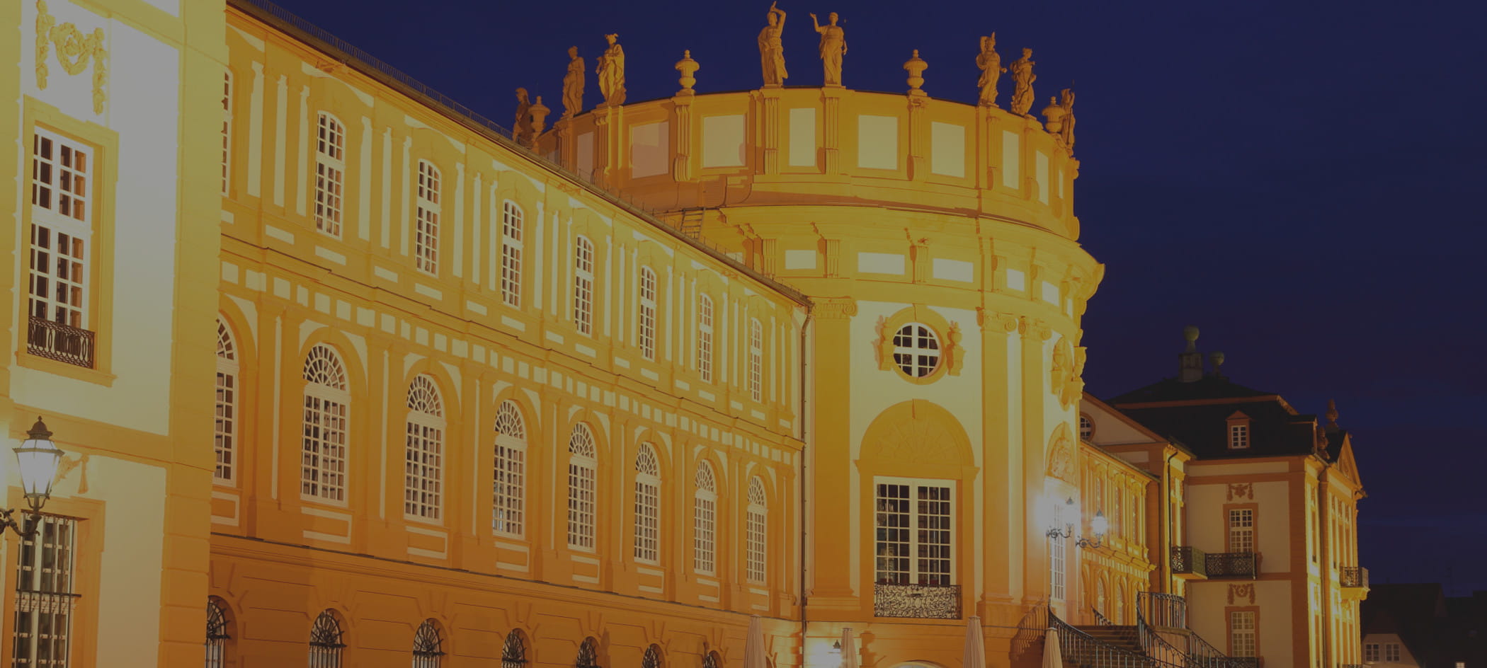 Large German building at night.