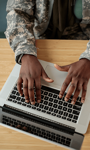 Military student working on laptop
