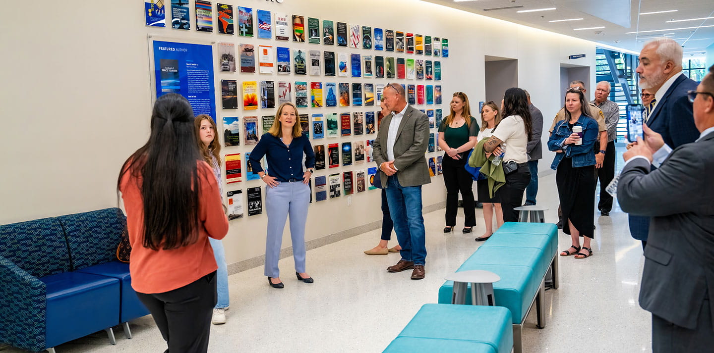 People in front of the Eagle Authors wall