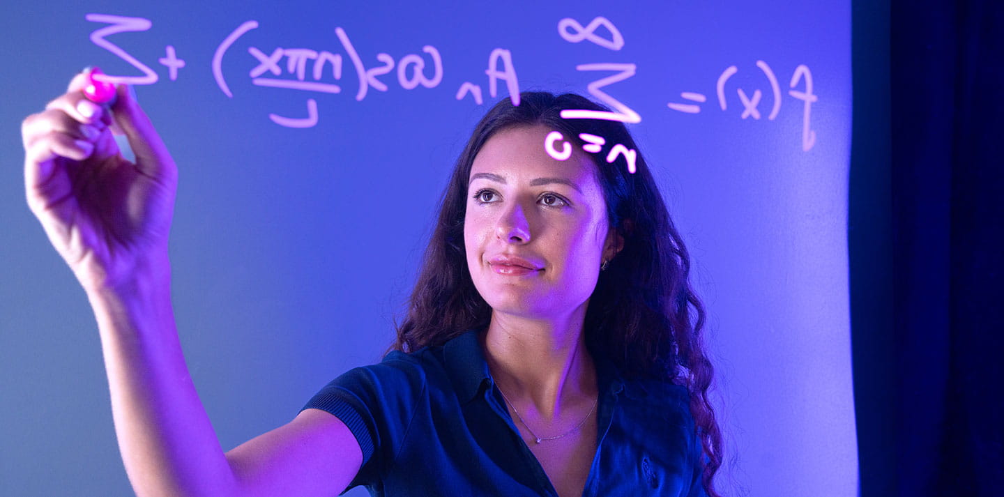 A professor uses Google Glass to complete a math equation
