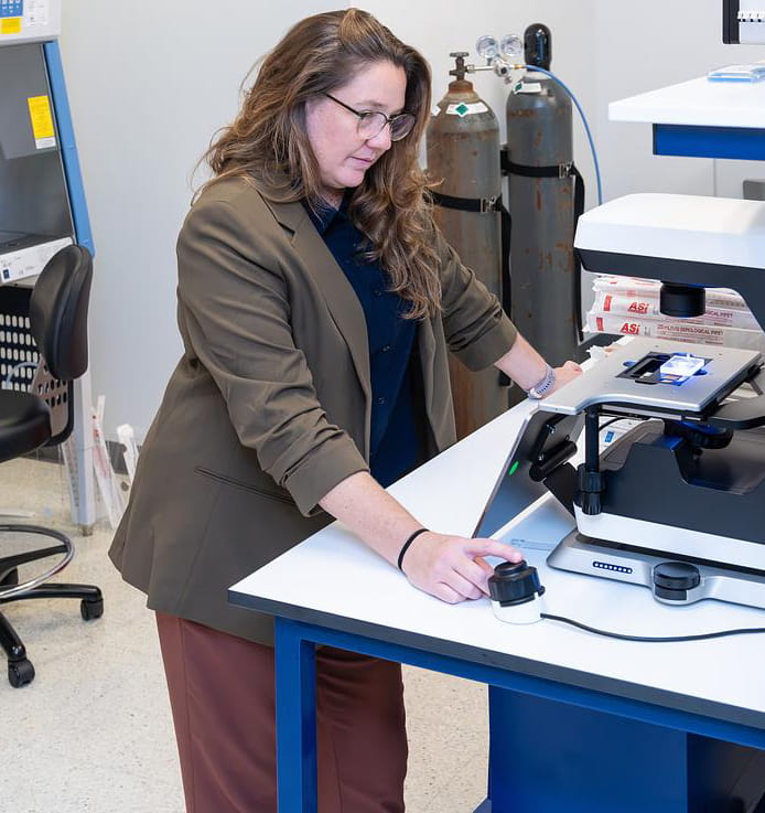 Woman looking at data in a lab.