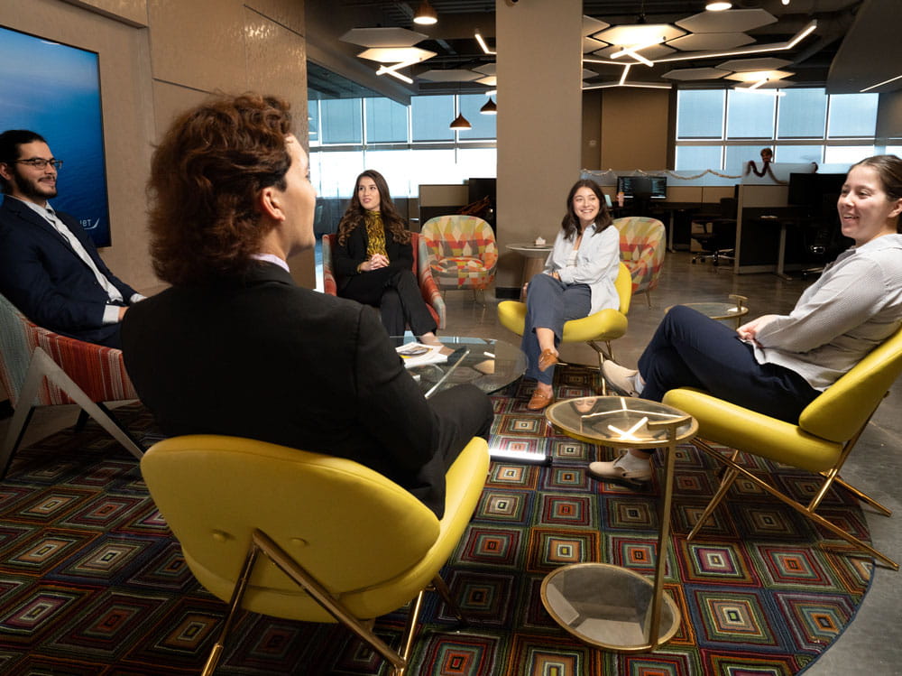 Students sit in a conference room.