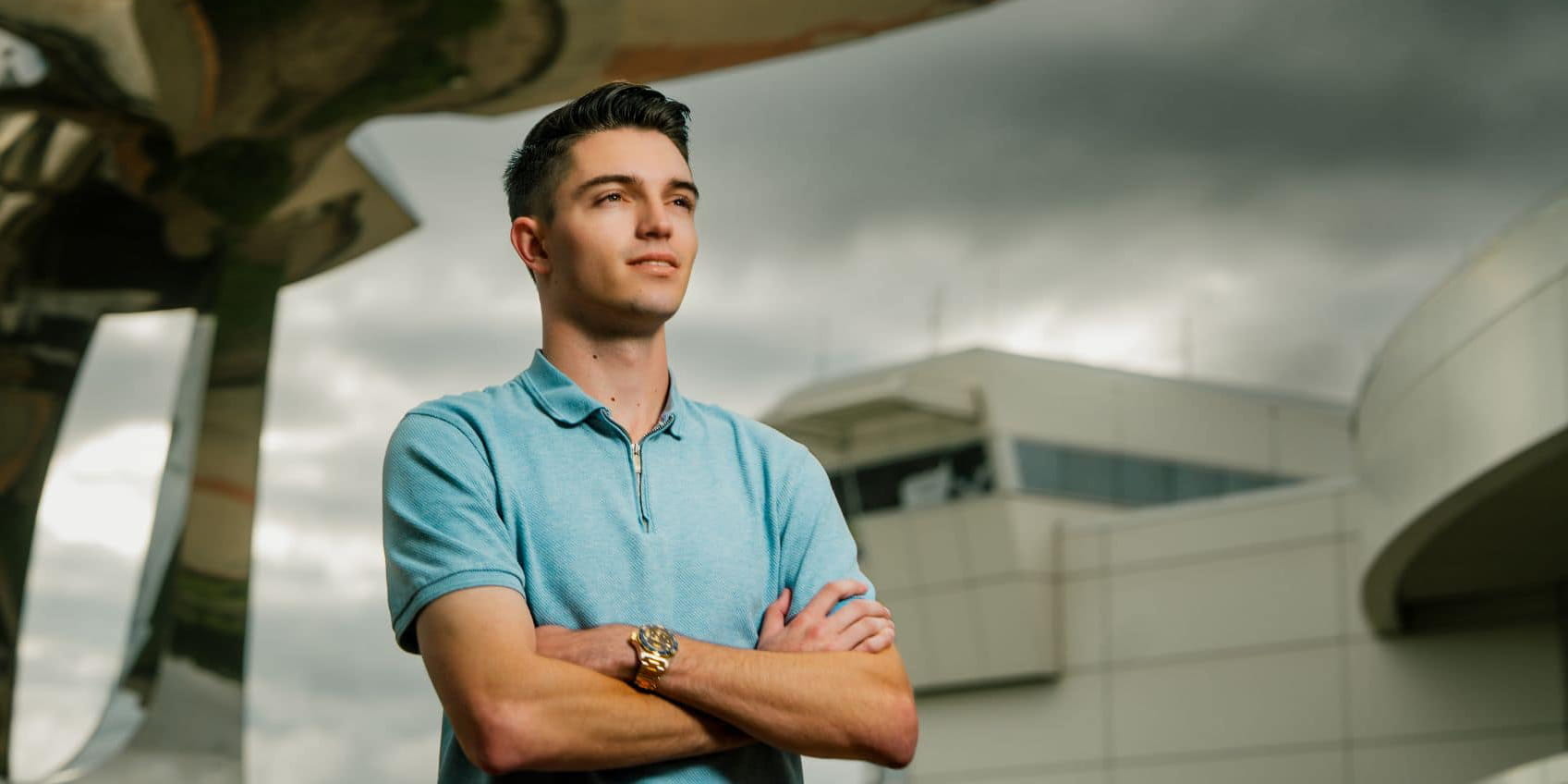 Toby Sopp stands with his arms cross on the Embry-Riddle Daytona Beach campus