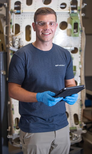 Man holding tools for working on planes.