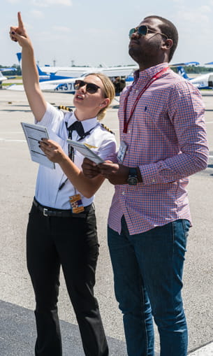 Woman and man examining a plane.