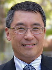 Portrait of Dr. Gregory Woo outside