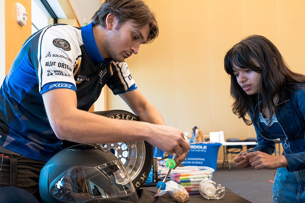 Two Embry-Riddle students work on building an engineering project during Engineers Week