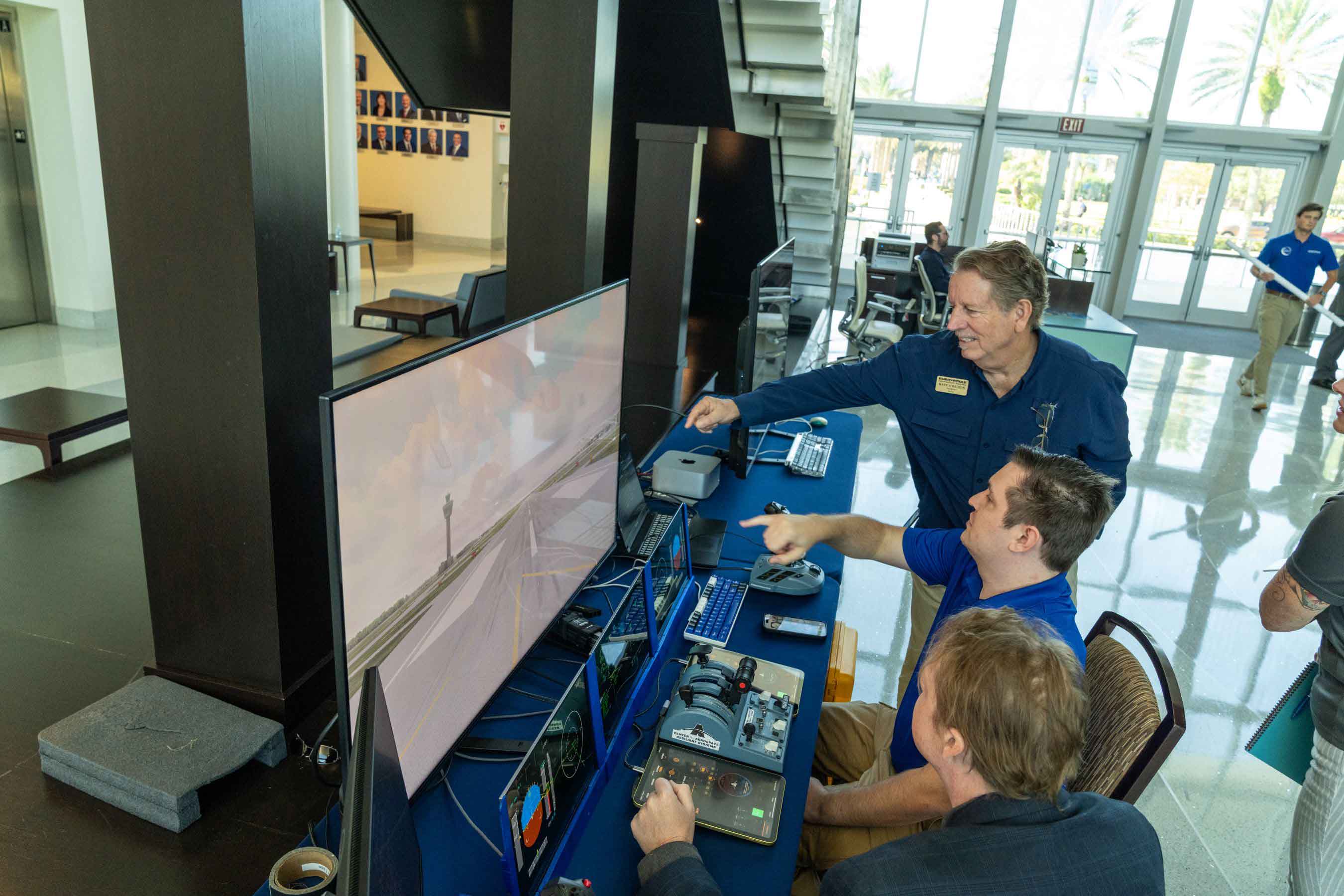 An Embry-Riddle AI Summit attendee checks out the Portable Cockpit Demonstrator, an AI-driven immersive system developed by the university’s Center for Aerospace Resilient Systems (CARS).