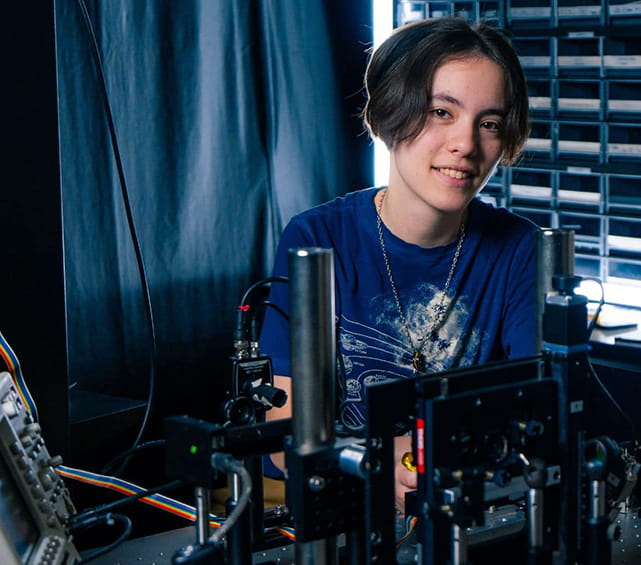 Embry-Riddle student sits in a physics lab