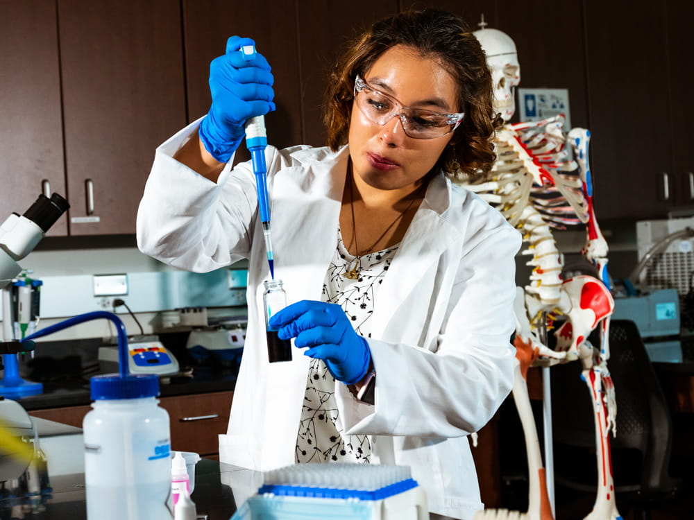 Woman in the Prescott chemistry lab.