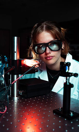 Breck Meagher working in the Optics Lab