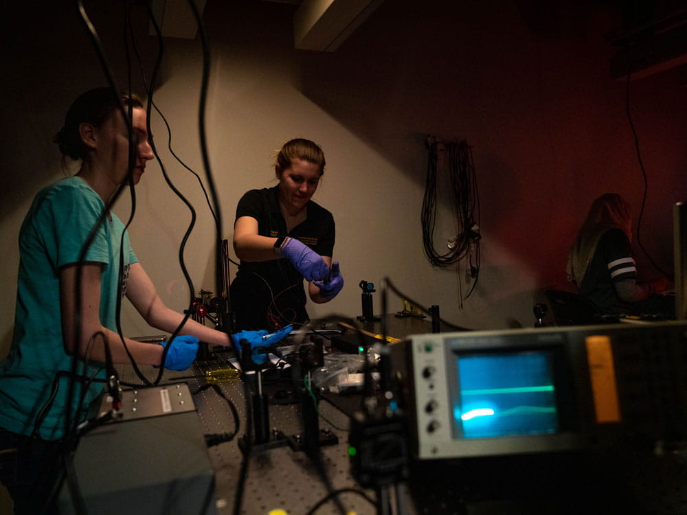 Students work on a laser project.