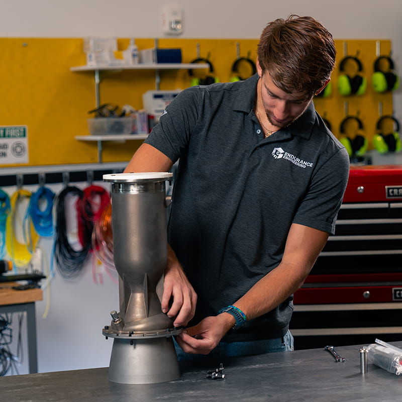 Embry-Riddle student works on a piece of machinery in a lab