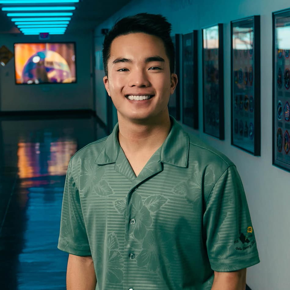 Alexander Kam stands in a hallway on the Embry-Riddle Prescott campus