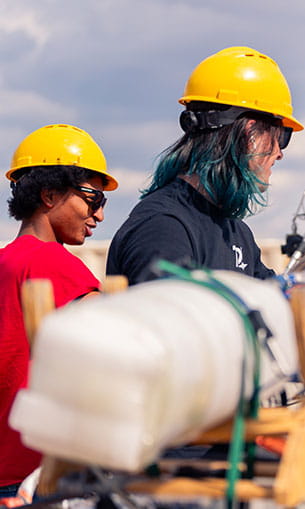 Students work on a rocket