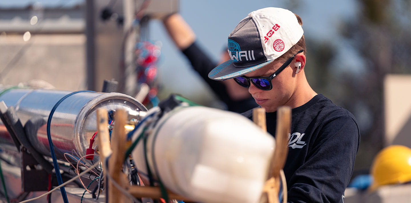 A student works on a rocket