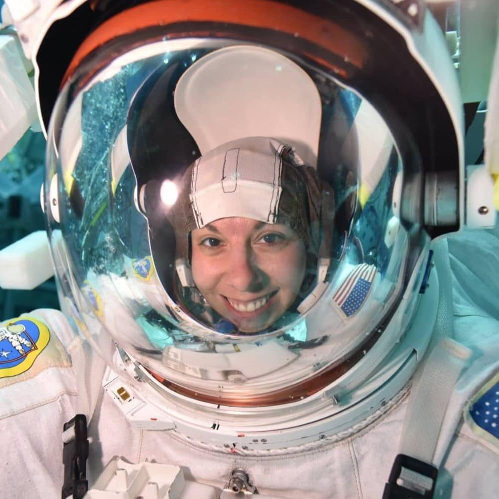 Lauren Maples wears an astonaut suit