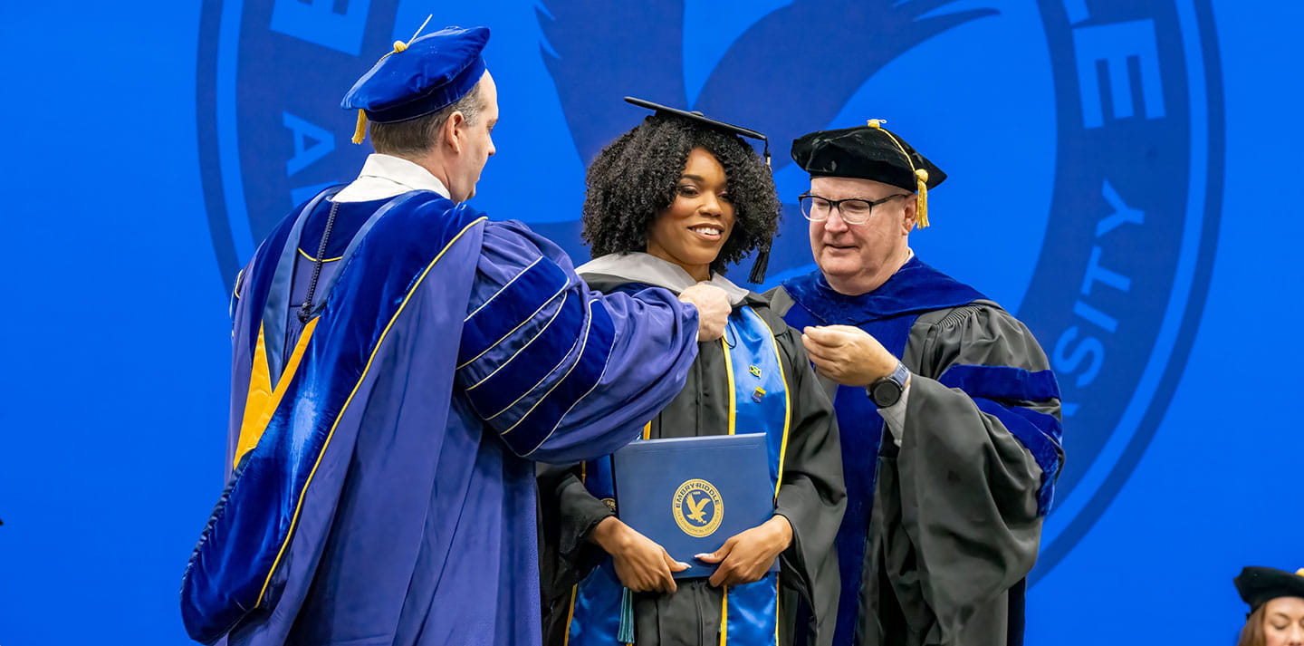 Student receives diploma during graduation