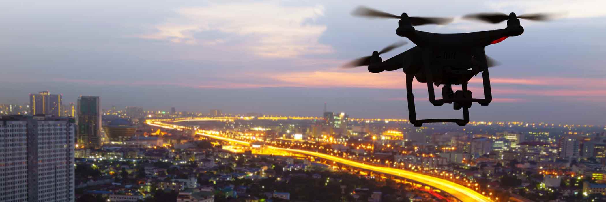 A drone hovers over a city