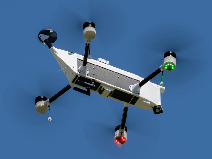 Small four propeller drone.
