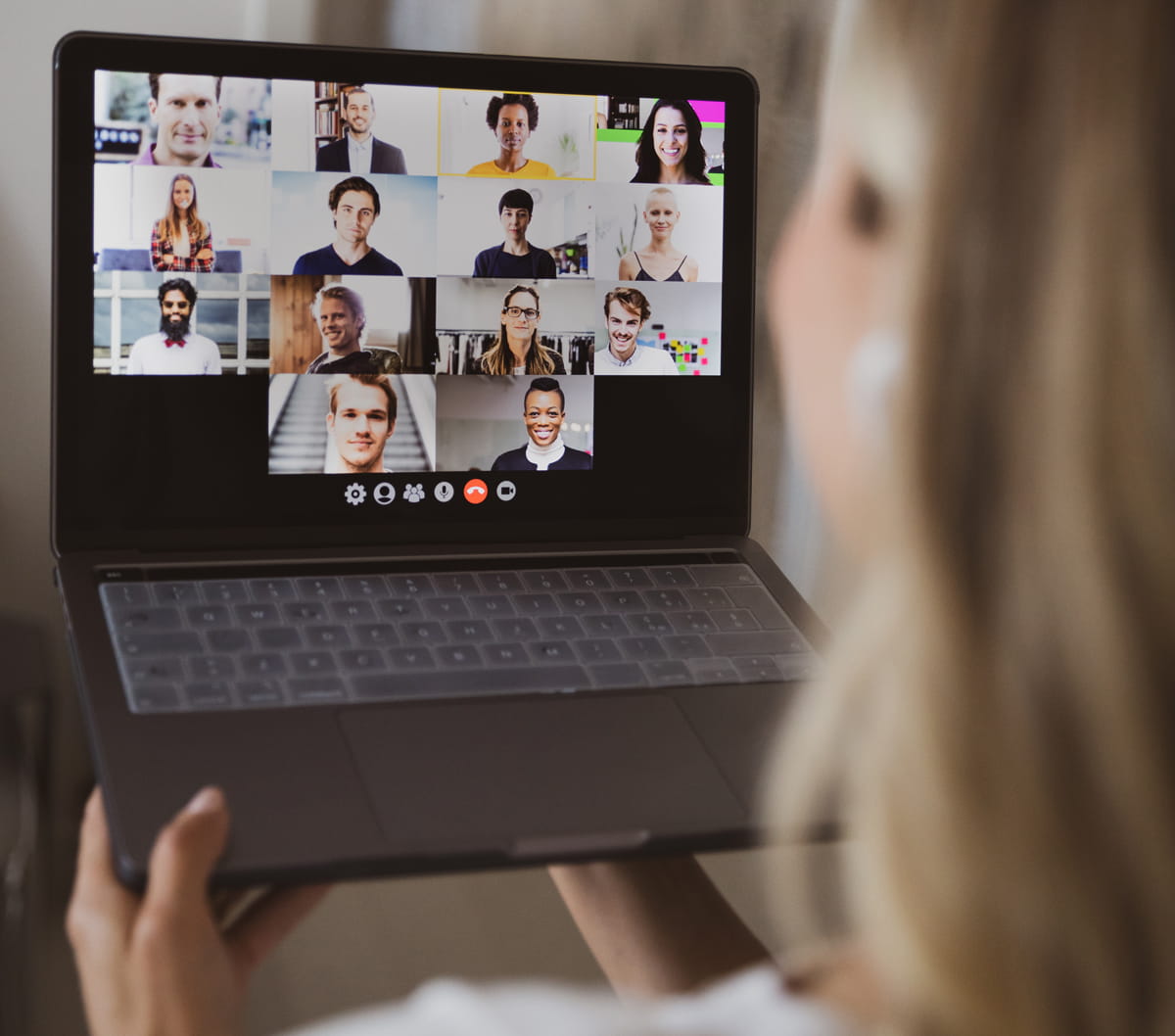 Woman watches a webinar on a laptop.