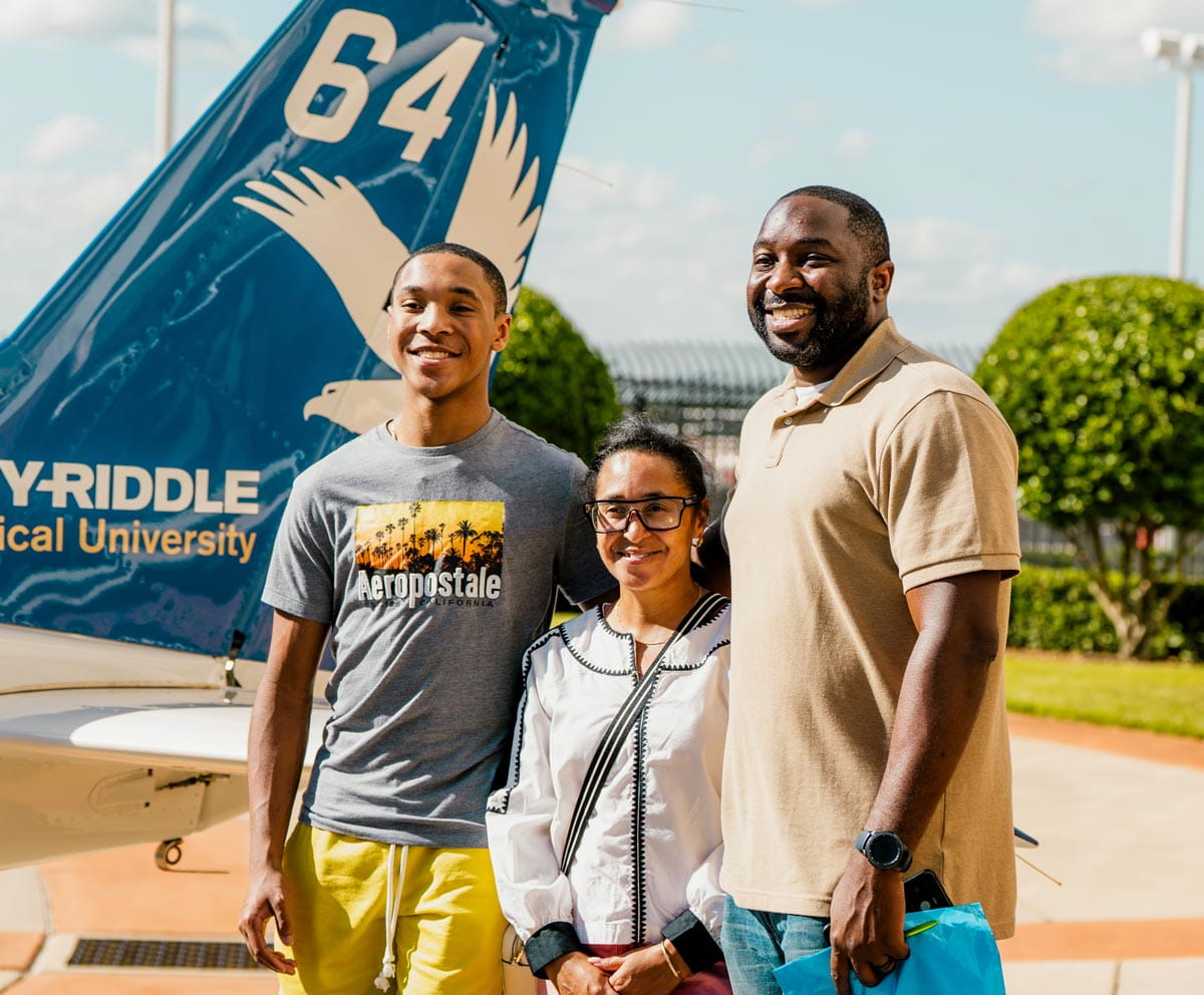 Family takes a group picture at the Daytona Beach Open House.