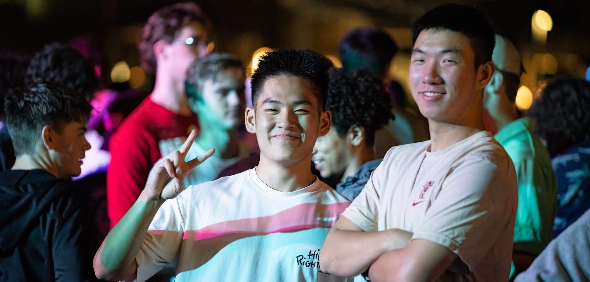Students waving at camera