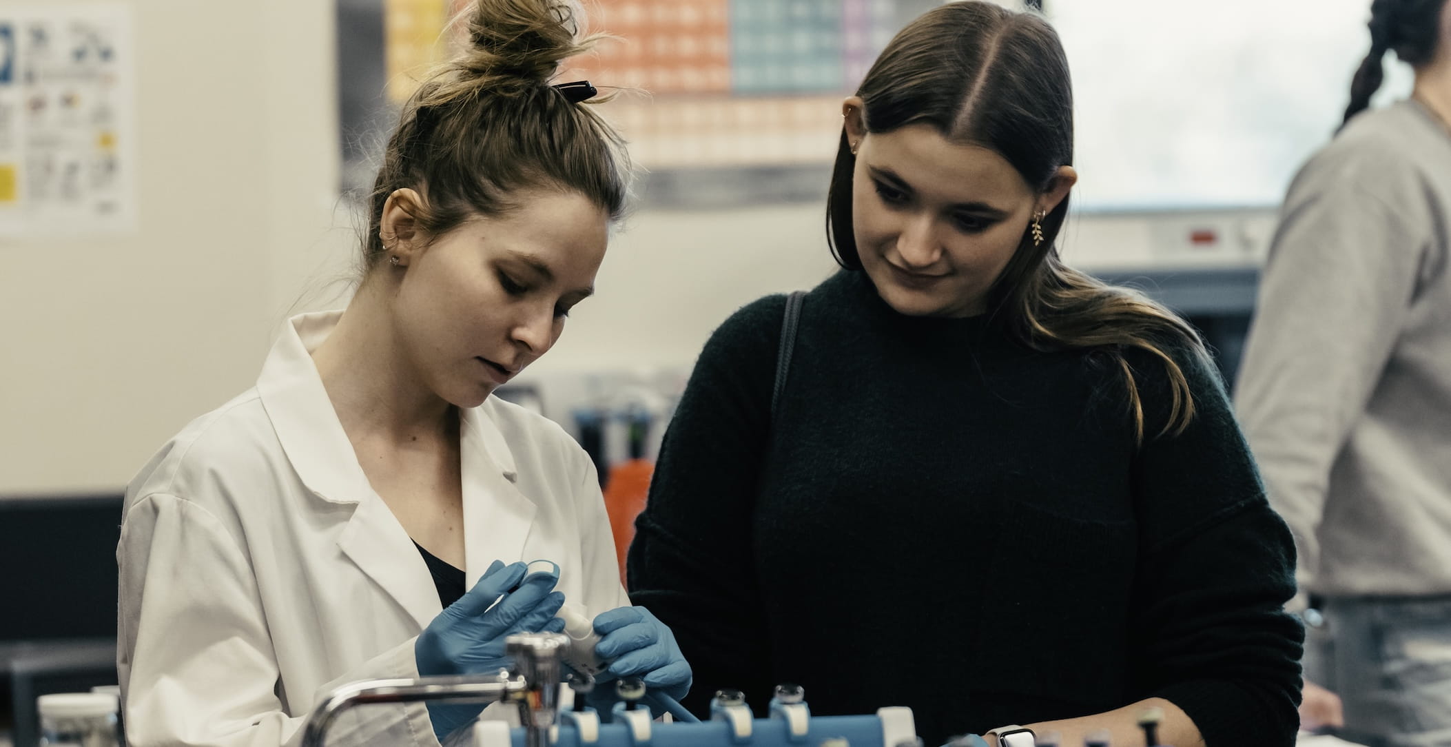 A student views a demo in a lab