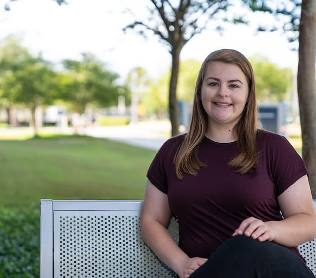 Student sitting on a bench
