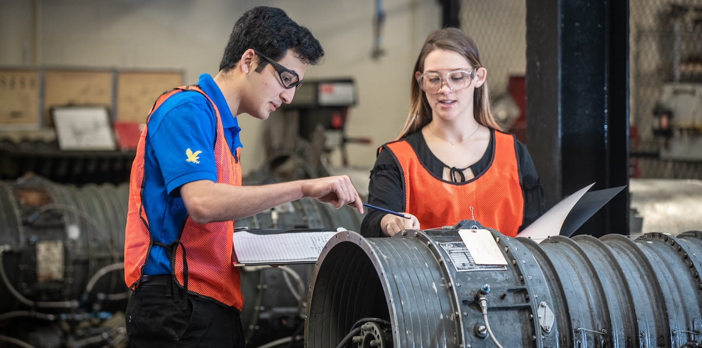 Two students reviewing safety measures