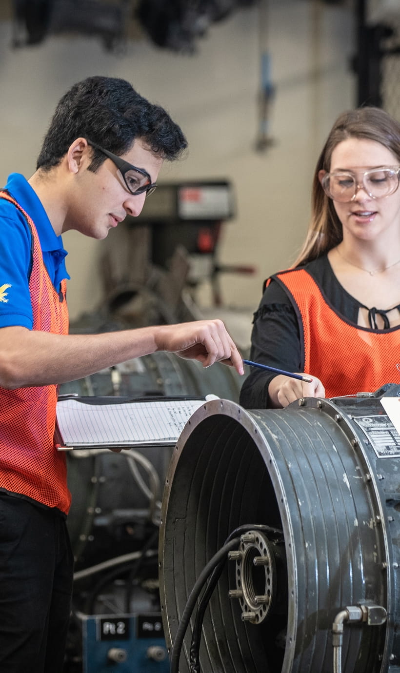 Two students reviewing safety measures