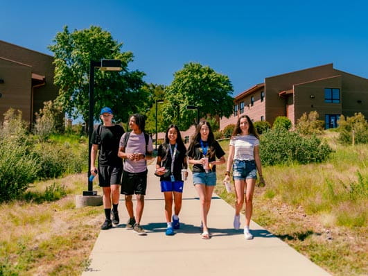 A group of students walking together on the Prescott ERAU campus.