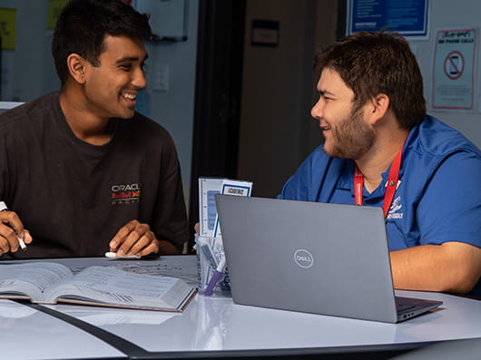 Two students sitting at a table.