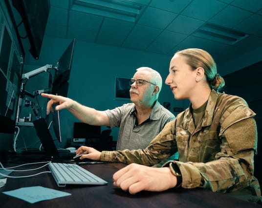 Professor and student inside the SARA telescope