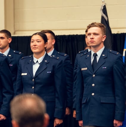 Military graduates stand in a line