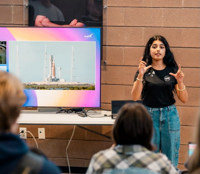 Student presenting research paper