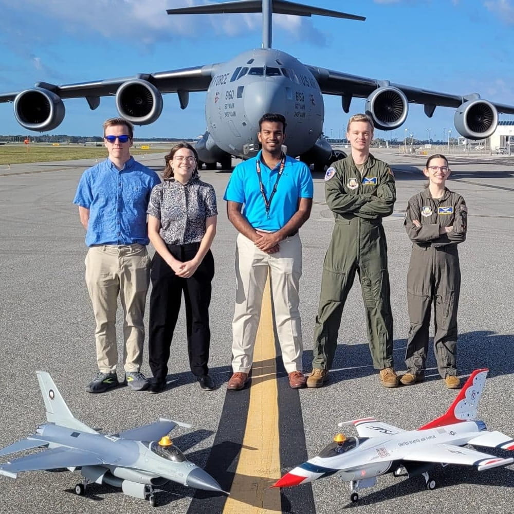 Ryan Mangra in front of a plane