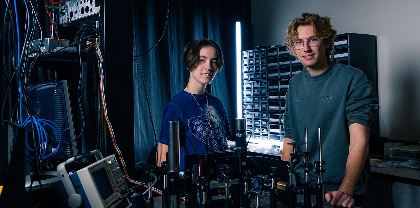 Two students in the Laser Optics Lab