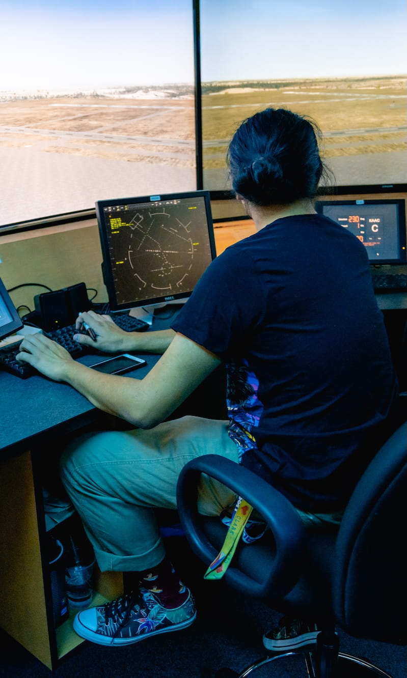A student partakes in an Air Traffic Control simulation