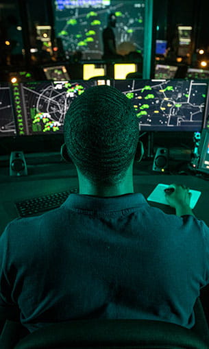 A student in the Air Traffic Management Lab