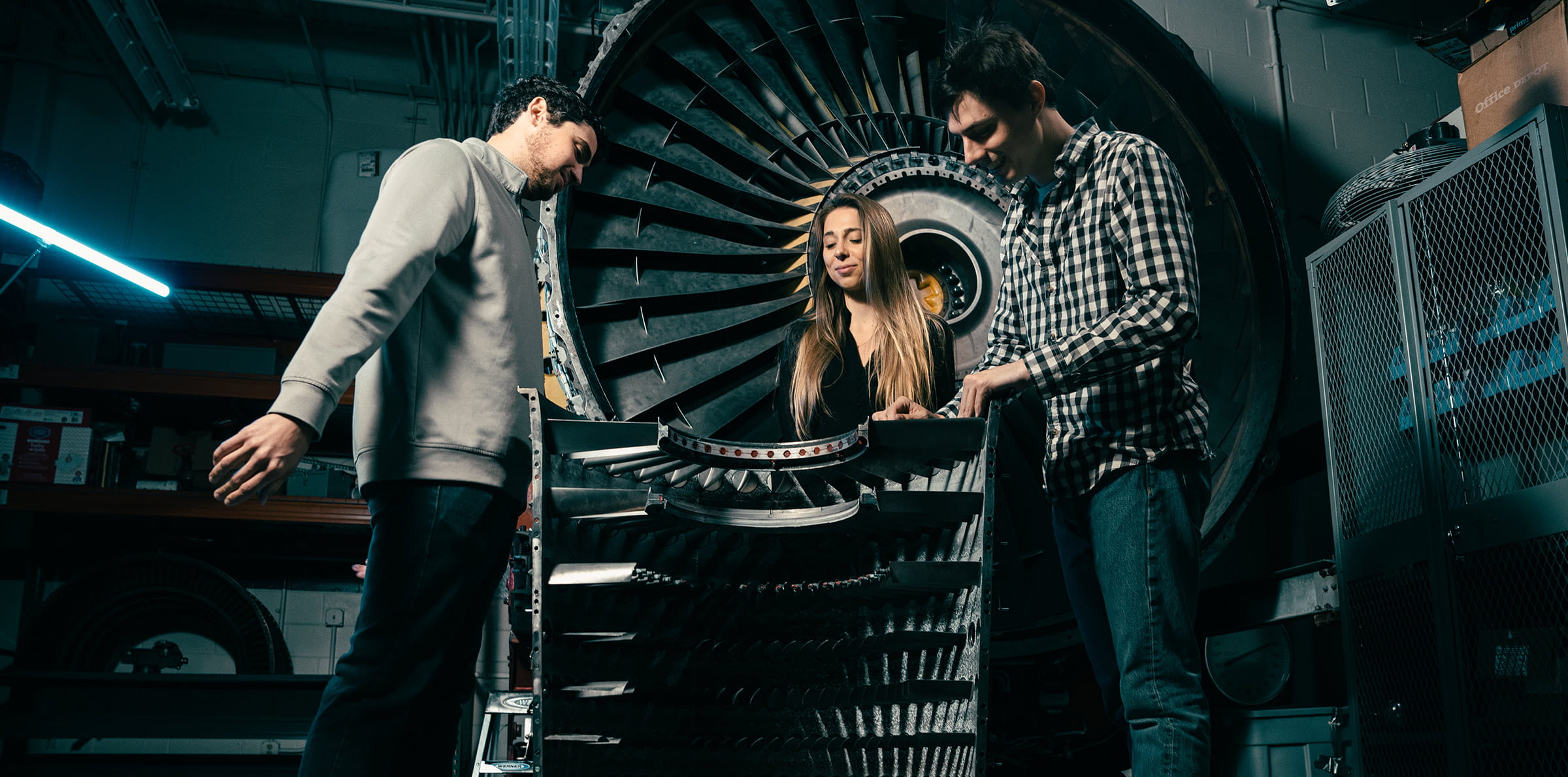 Aerospace Engineering students working together in a lab.