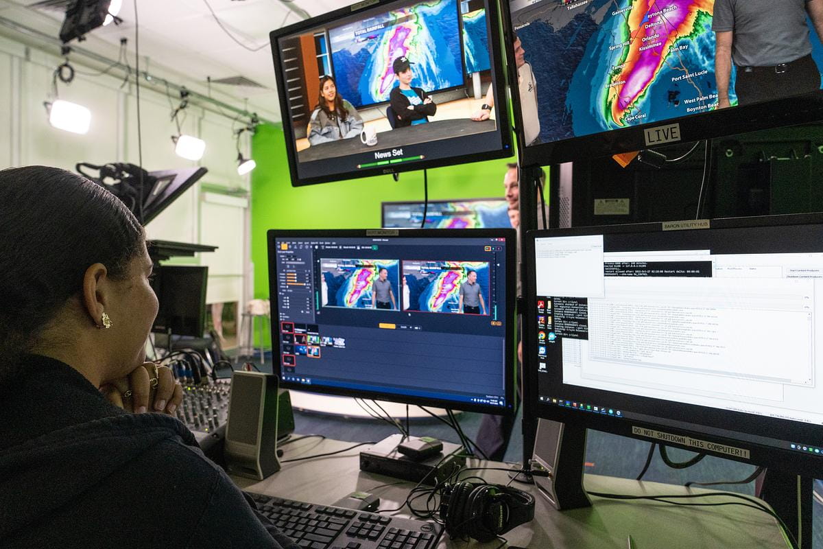 A student looks at a computer screen in Embry-Riddle's TV Studio Lab.
