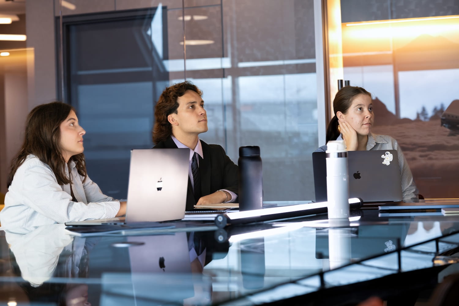 Students and interns working in a business environment.