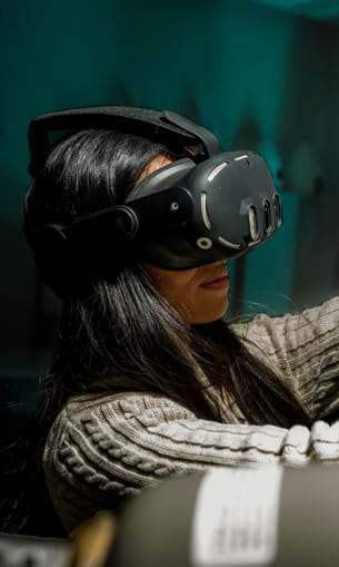 A person wearing virtual reality goggles.