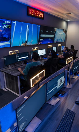 Students participate in a space operations scenario.